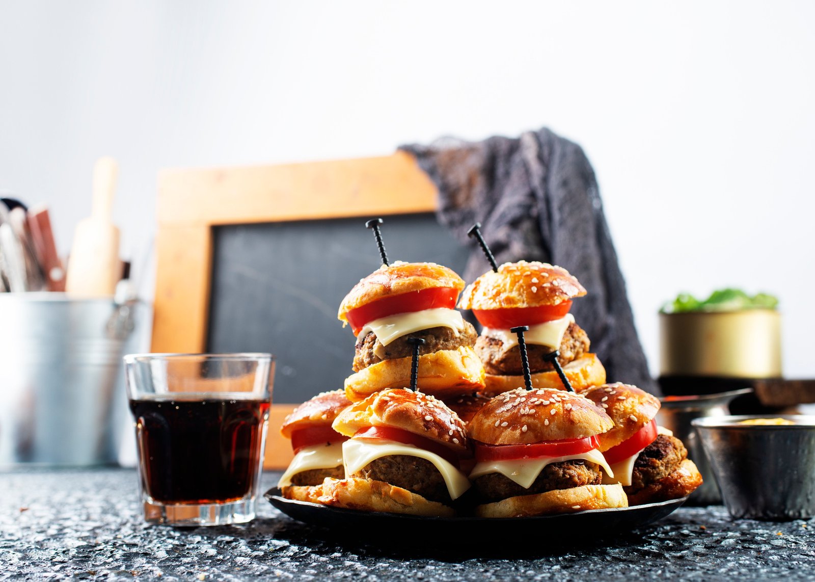 homemade beef burgers with cheese on serving board