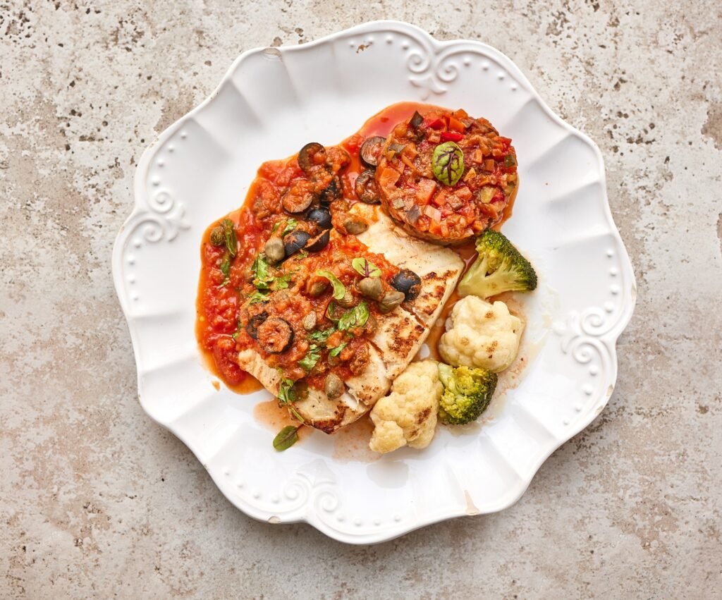 portion of cod fish with vegetables
